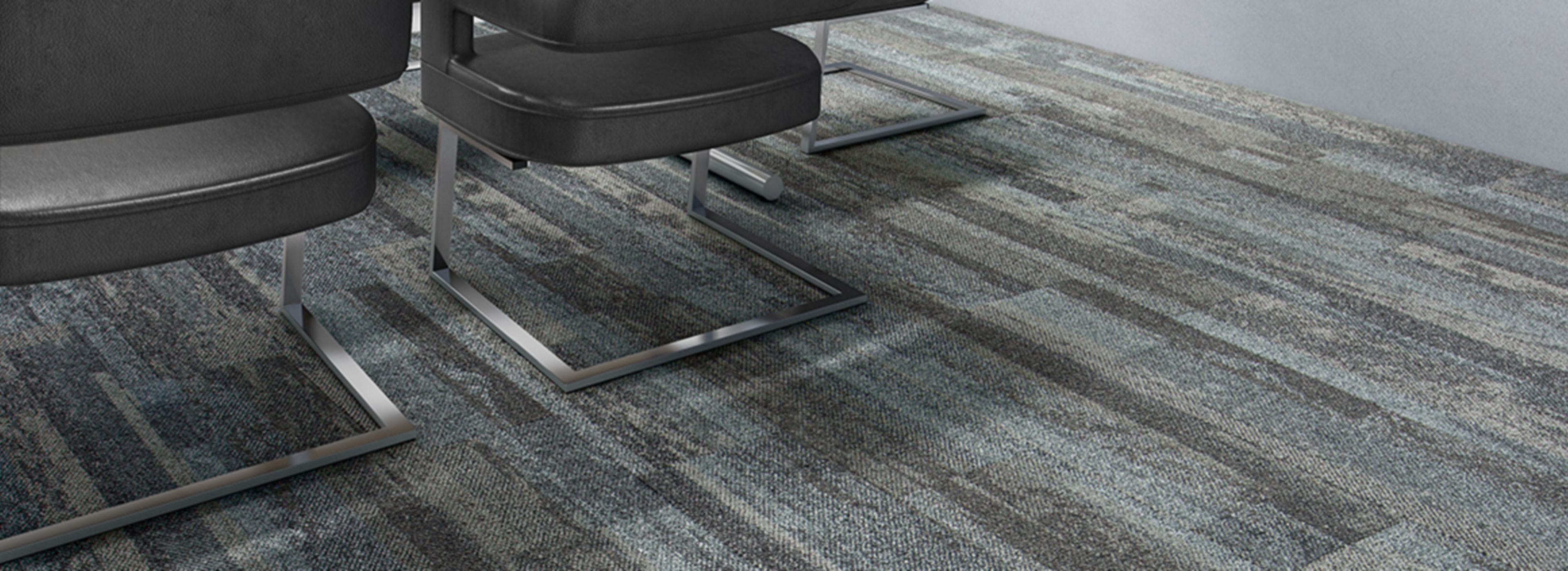 Interface Naturally Weathered plank carpet tile in office meeting room with reflection of natural light through windows image number 1